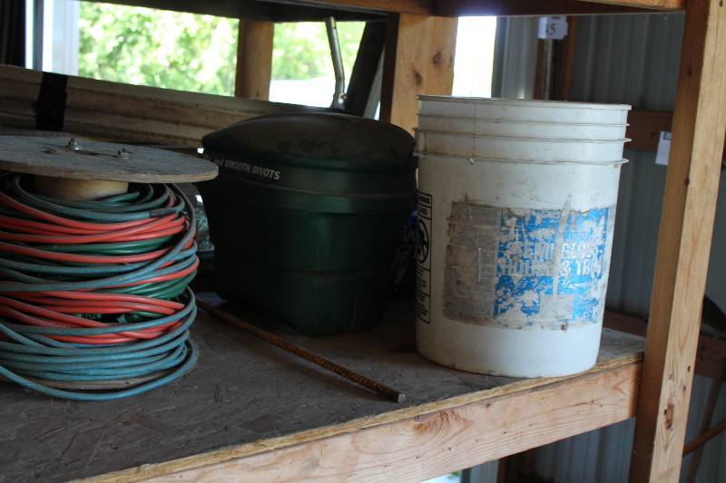lot 276 image: Shelf Lot Including Spindle Of Extension Cords Plastic Container For Sand To Smooth Divets Box of Plastic Hardware And More.