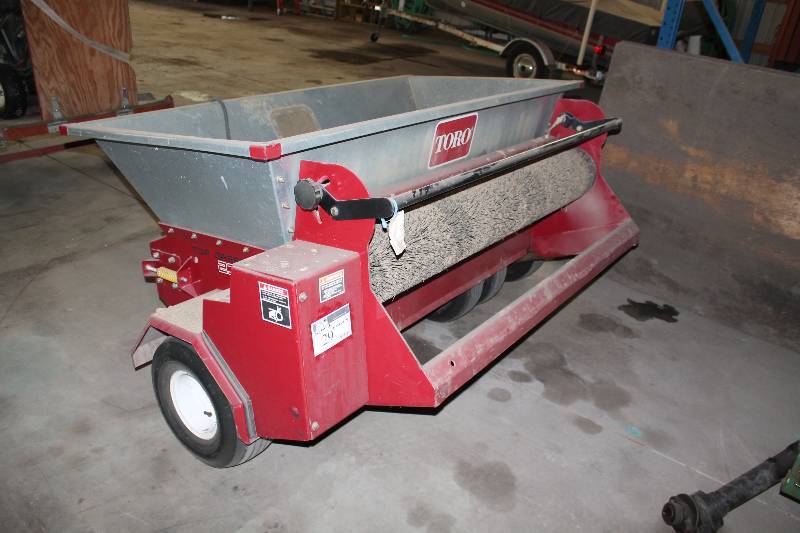lot 29 image: Toro Pull-Behind Top Dresser 2300 Bucket Dimensions 40 x 76.5 x 19.