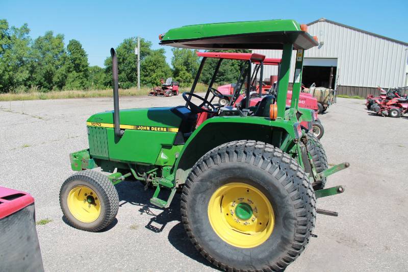 lot 13 image: John Deer 1070 Wheeled Harvester Tractor wFront Bucket Attachment & Overhead Awning 3366 Hours Tested & Operational Bucket Not Included
