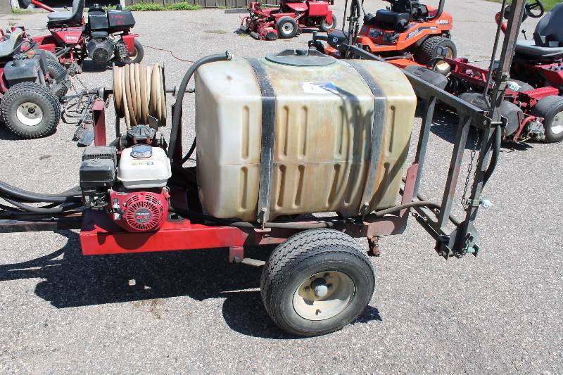 lot 4 image: Commercial Sprayer Trailer w2 Wheels & Hitch, Plastic Reservoir Tank Honda Motor Hoses & Reel Metal Frame 2884.9 Hours Includes Trailer Only Does Not Include Attached Tractor.