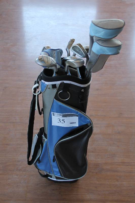 lot 35 image: Golf Lot Including Golf Bag wCarrying Straps Aspect Fairway Driver Idea Womens Putter Miscellaneous Irons And More.