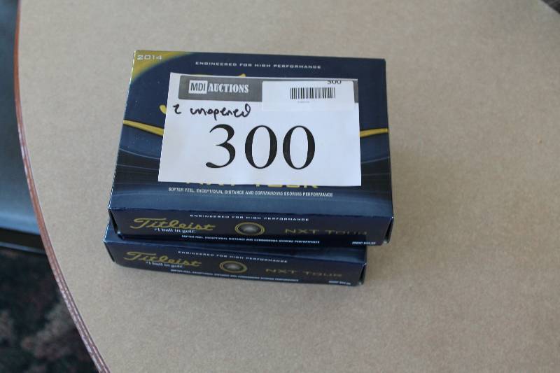 lot 300 image: Case Lot of (2) Titleist NXT Tour Golf Balls.