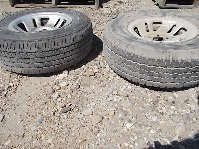 lot 215 image: (2) Rims with Asstd 15 Tires...