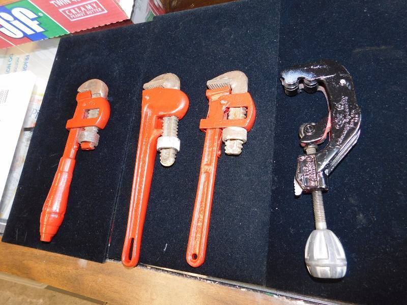3 pipe wrenches and a cutter