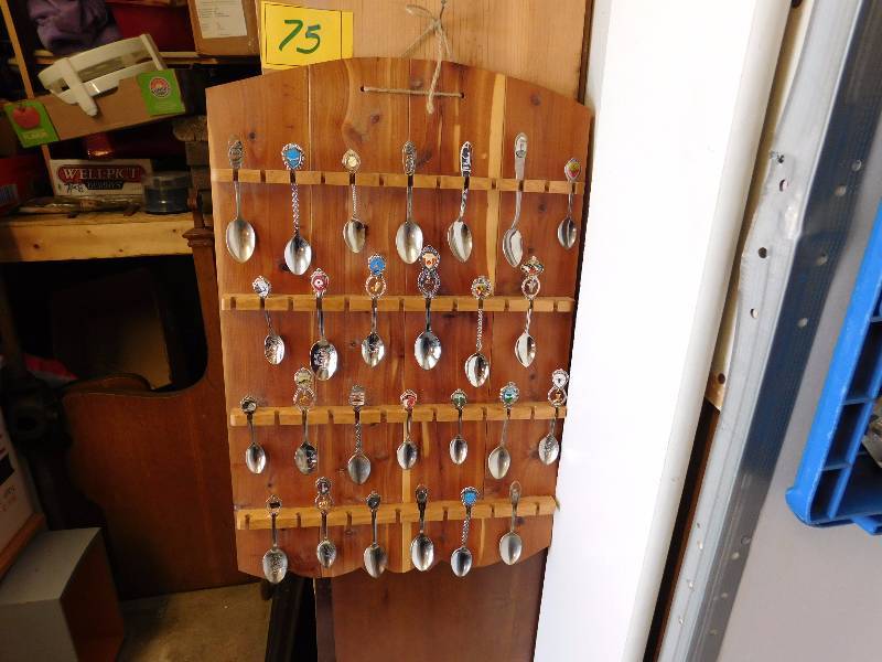 25 collector spoons on spoon display