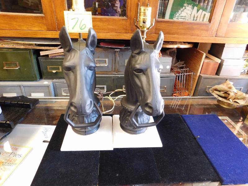 2 black aluminum horse head lamps on wood base