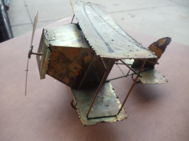 lot 182 image: Metal Musical Airplane