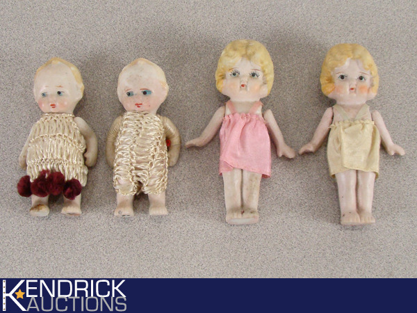 lot 3 image: 4 Antique Hinged Arm Hand Painted Porcelain Dolls