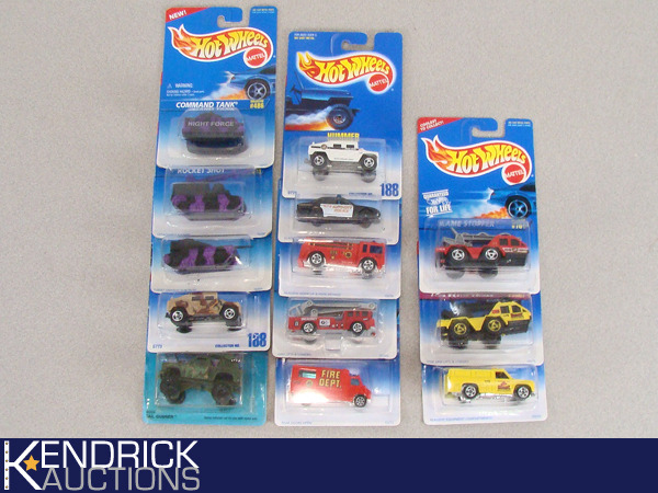 lot 62 image: 13 Vintage MINT ON CARD Hot Wheels Military, Police, and FireRescue Cars