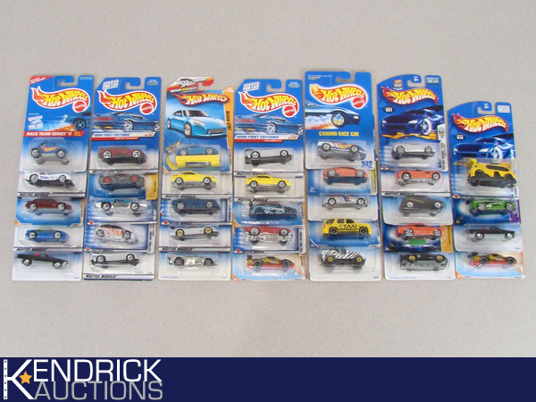 lot 63 image: 34 Vintage MINT ON CARD Hot Wheels Luxury, Sport, and Muscle Cars