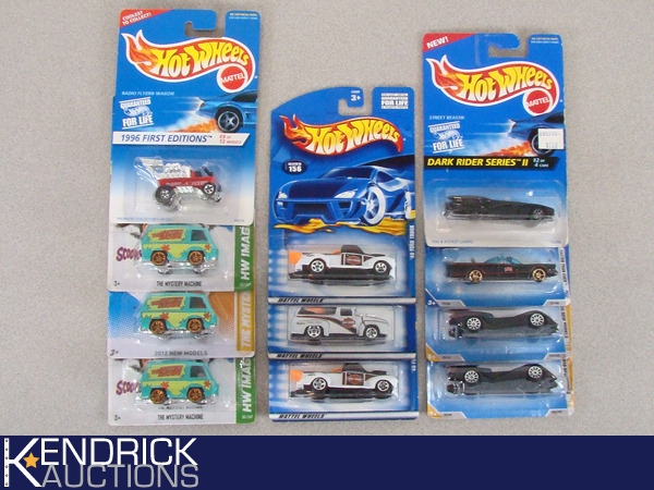 lot 65 image: 11 Vintage MINT ON CARD Hot Wheels Scooby Doo, Harley, Batmobiles, and Radio Flyer Cars