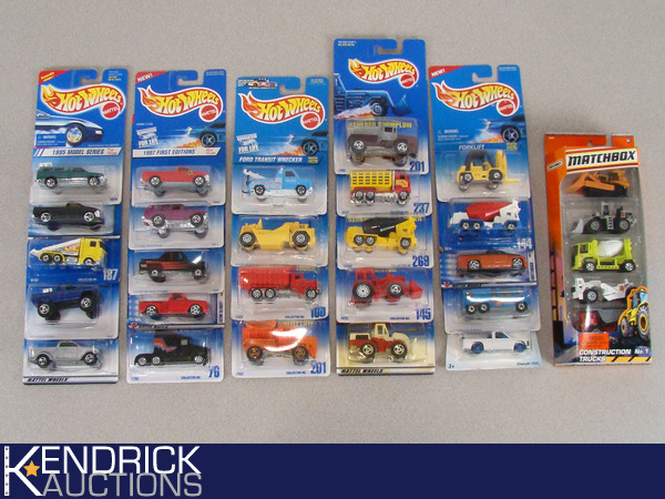 lot 67 image: 29 Vintage MINT ON CARD Hot WheelsMatchbox Trucks, and Construction Vehicles