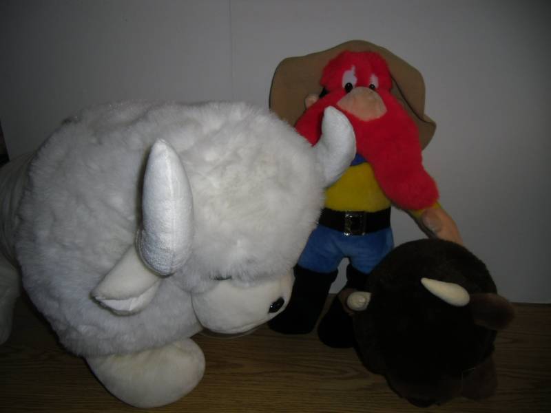 lot 26 image: Large White Buffalo  Brown Buffalo  Yosemite Sam Plush Stuffed