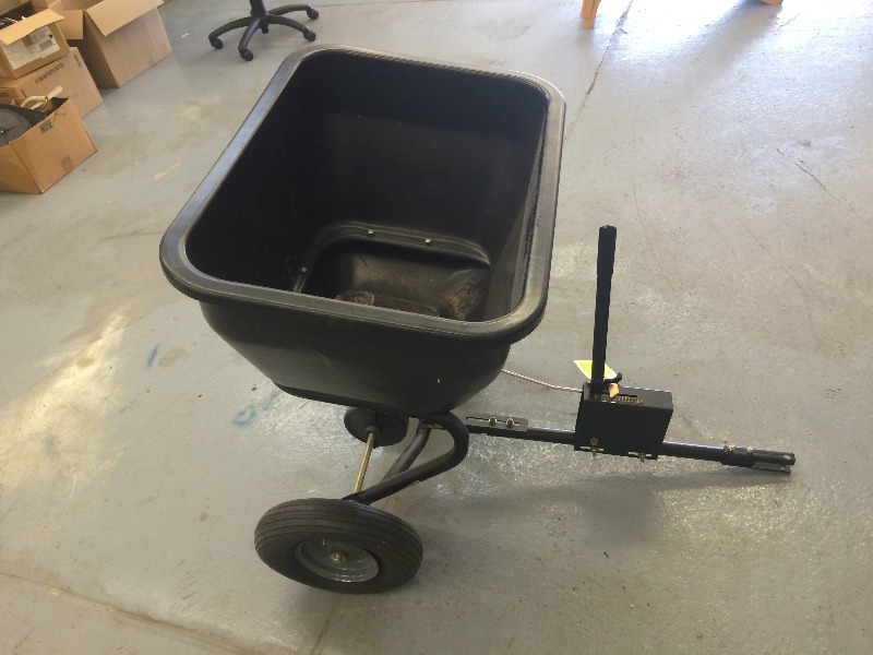 lot 7 image: Pull behind seeder  fertilizer spreader  measures 29 L x 21 H x 18 D