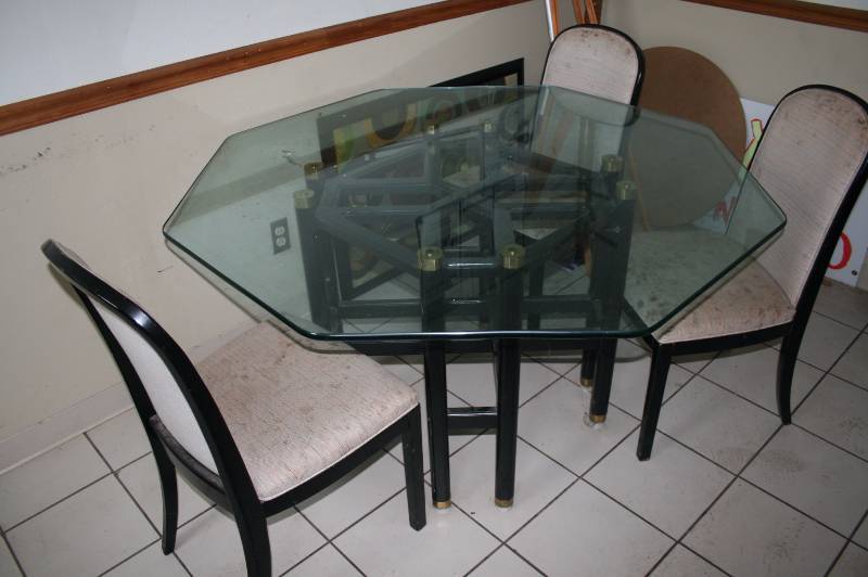 Glass top dining table with chairs