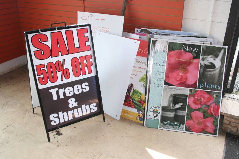 Metal Sign holder and lot of signs