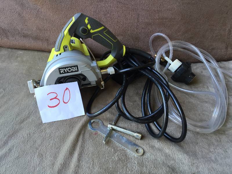 lot 30 image: Ryobi 4 Hand Held Wet Tile Saw