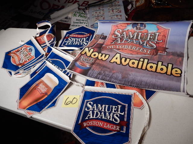 lot 60 image: Sam Adams Bannerpennant String.. About 20 ft. Plus 3 Sam Adams 2ft x 2ft posters