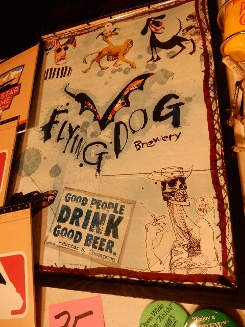lot 75 image: Flying Dog Brewery framed sign(glass is broken). Hiram Walker Sip Stick holder, All Star signage, Dr. Mcgillucuddy Buttons.