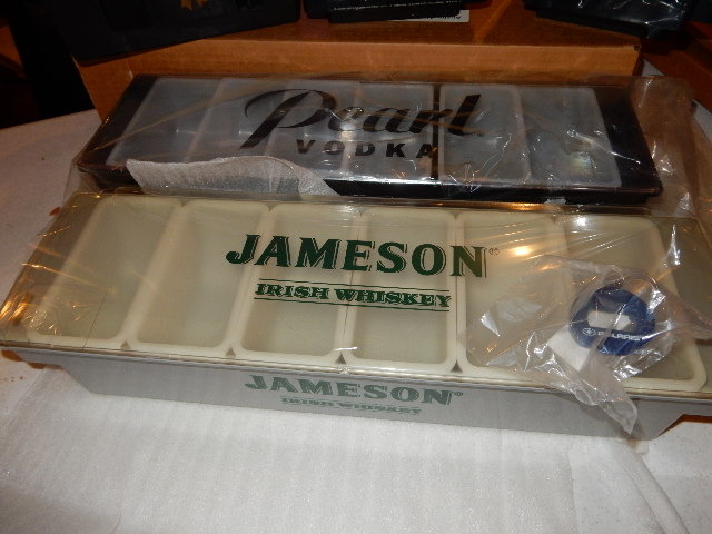 lot 67 image: Pearl vodka and Jameson Logod Condiment trays with cover, Seagrams and Pearl Napkin holders