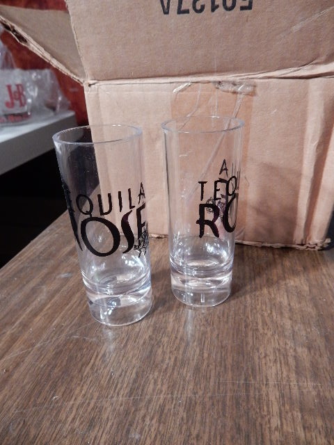 lot 97 image: Tequilla Rose Shot Glasses, 4 Kahlua mugs, 4  Goldschlager, equalizing shot glasses