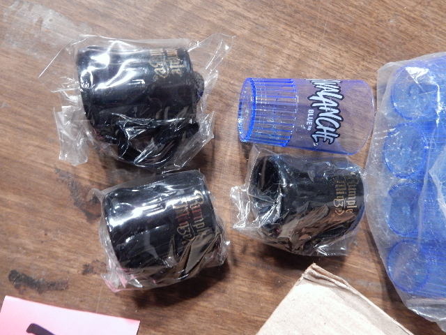 lot 101 image: 14 Rumple Minze, 24 Avalanche Blue Plastic Shot Glasses.
