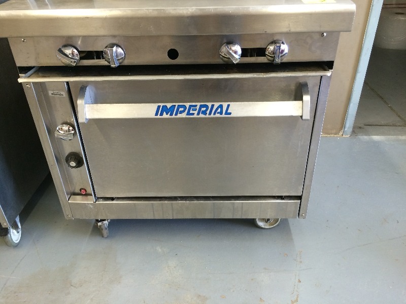 lot 1 image: Imperial Commercial 4 burner stove & oven, Nat Gas   approx. 5-8 years old- works