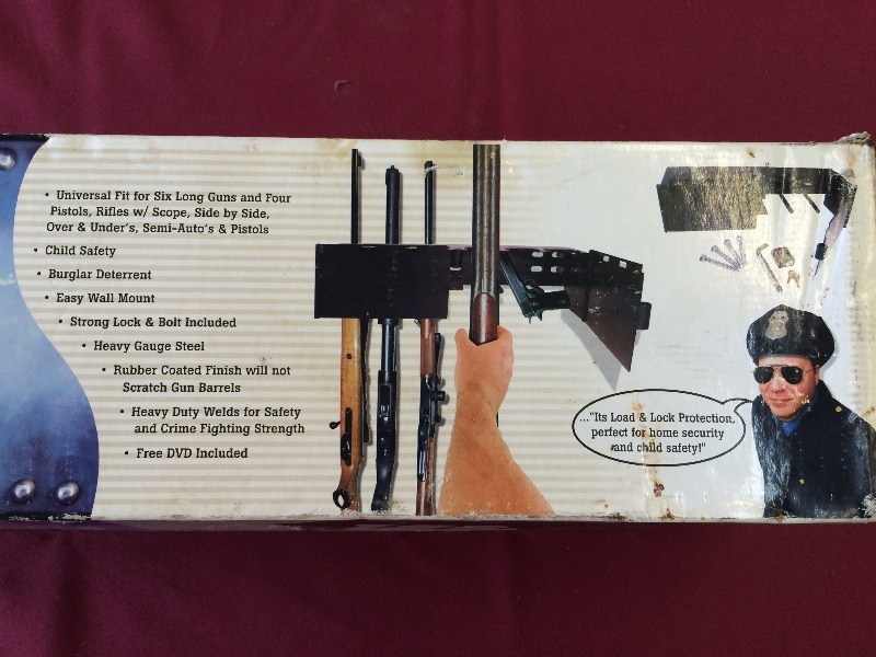 lot 145 image: Gun Rack - Security Lock - hangs on the wall  New in the box