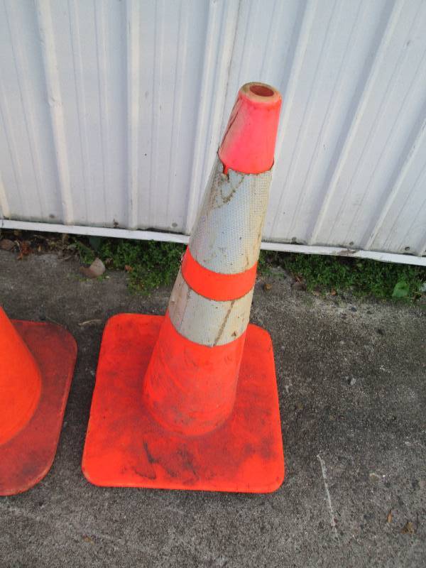 2 orange marker cones, one with ref...