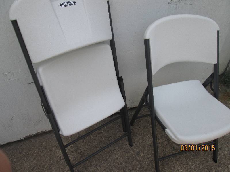 2 Lifetime folding plastic chairs i...