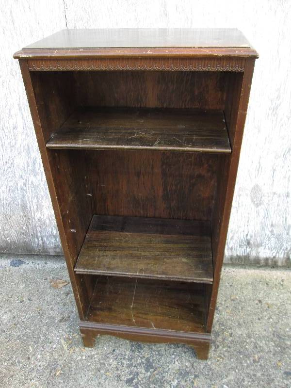 Wood shelf with adjustible pegs, to...