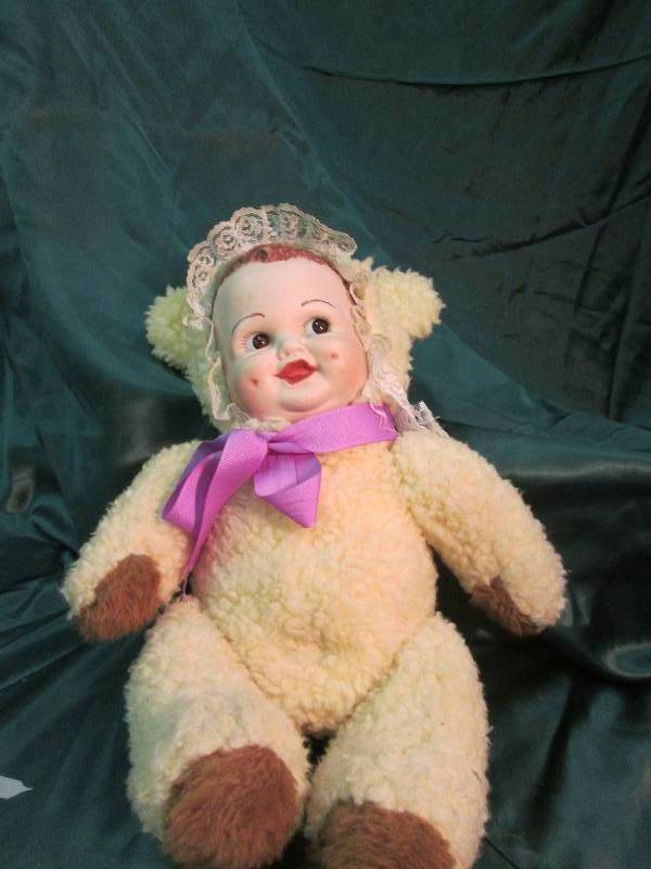 Porcelain Doll, Infant in a Teddy B...