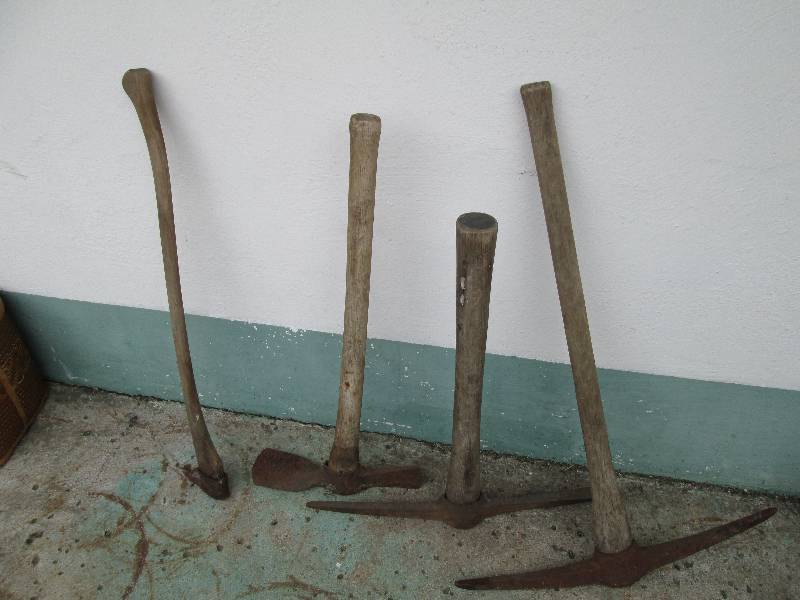 Lot of pick axes and hand tools...