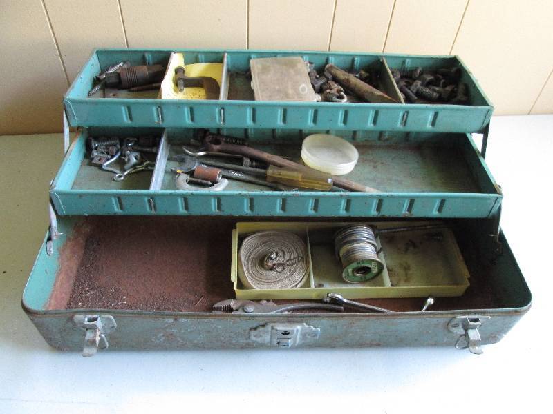 Tool box filled with c-clamps, chis...