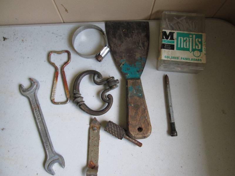 Scraper, hose clamp, box of colored...