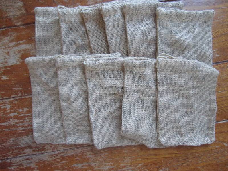 lot of 11 brown draw string pouches...