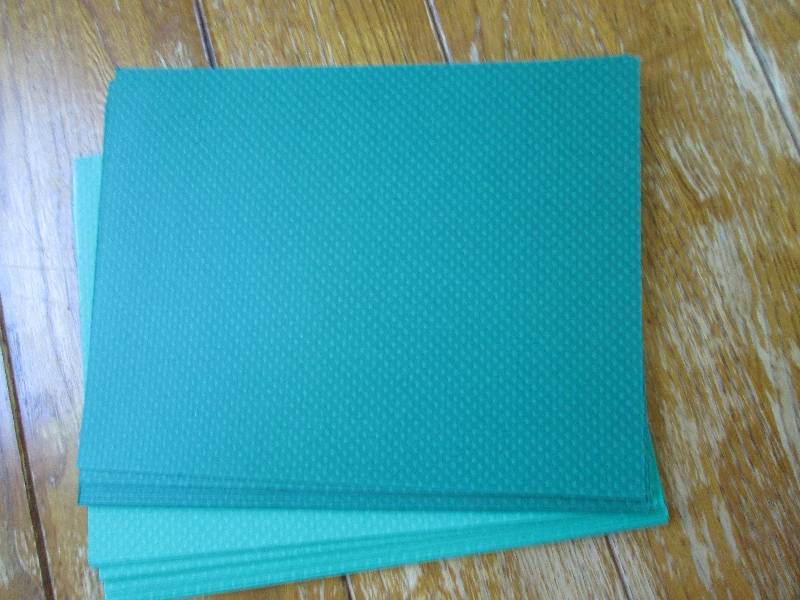 lot of green dotted scrapbook paper...