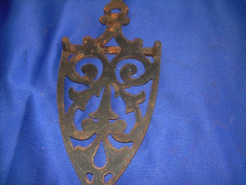 antique cast iron trivets