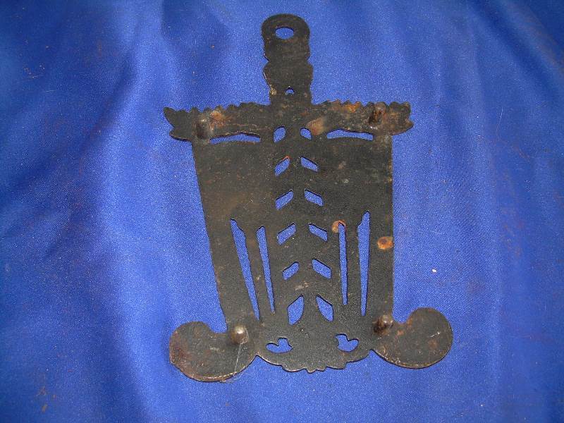 antique cast iron trivets