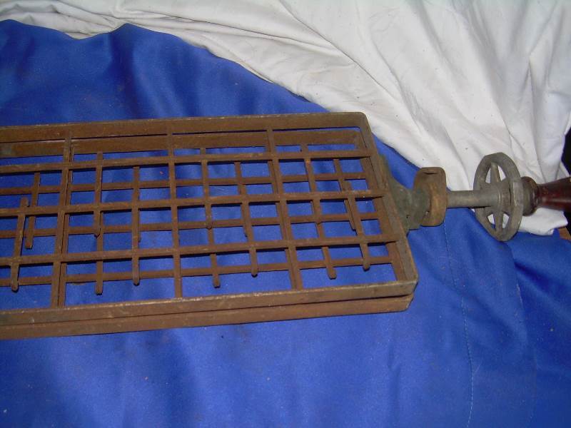 antique iron grate with handle