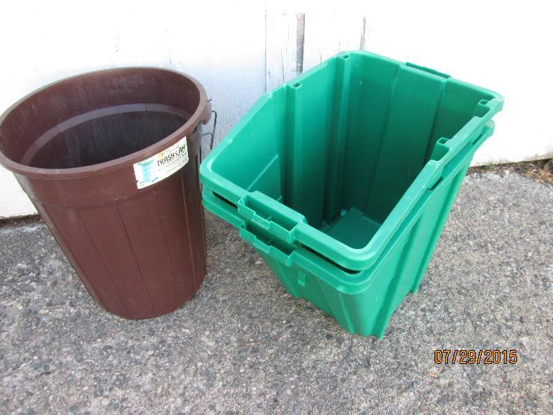 2 green storage bins, currently stu...