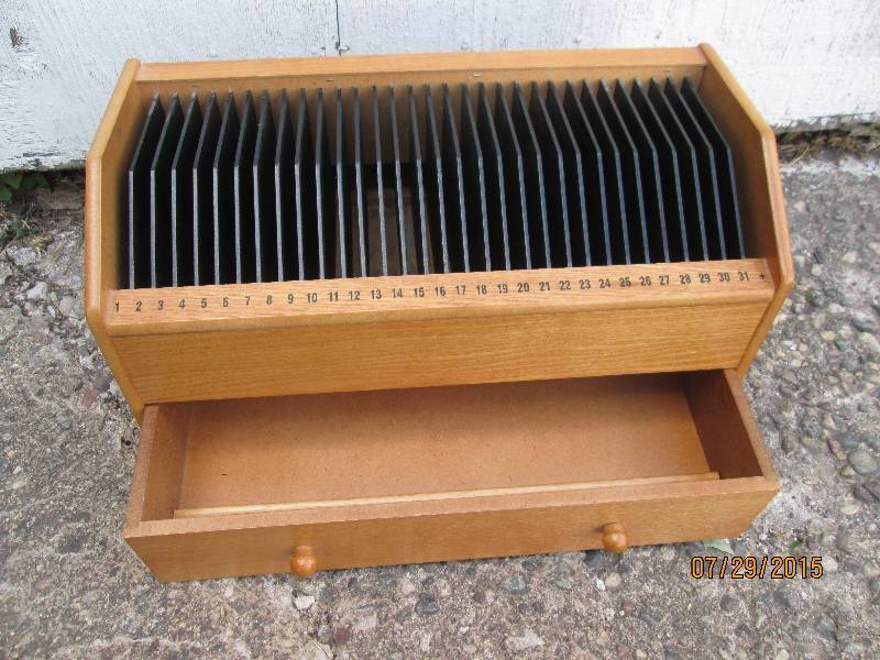 Wood organizer with a slot for each...
