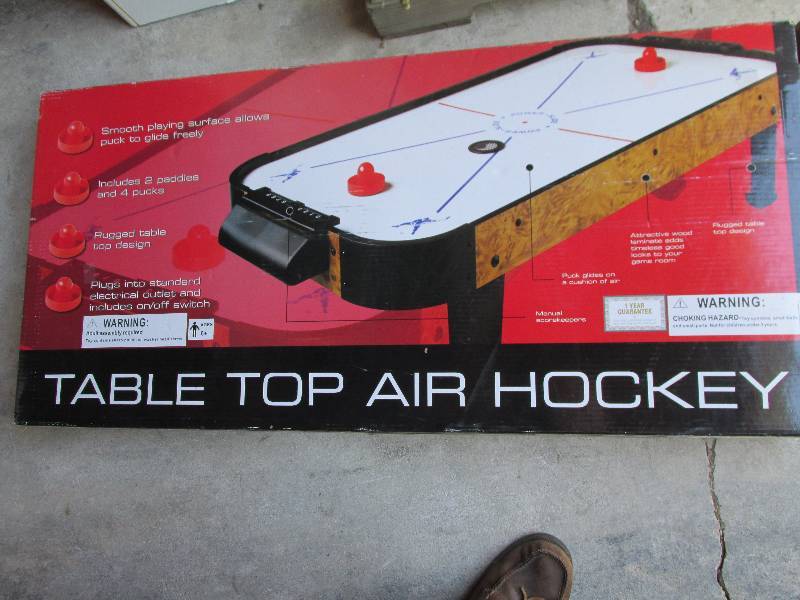 Table top air hockey game, in origi...
