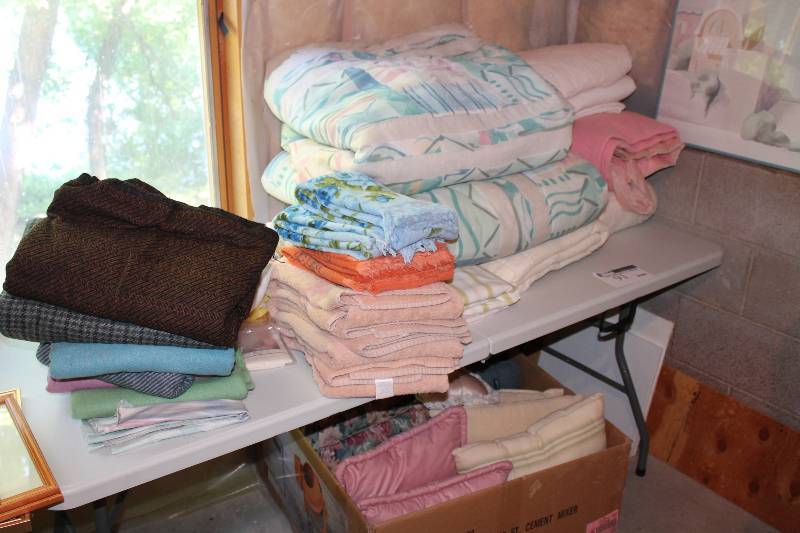 lot 91 image: Table Lot Including Box of Pillows Blankets.