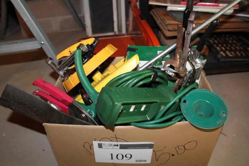 lot 109 image: Box Lot Including Extension Cord Shears Lawn Mower Blade Hose Attachment And More.
