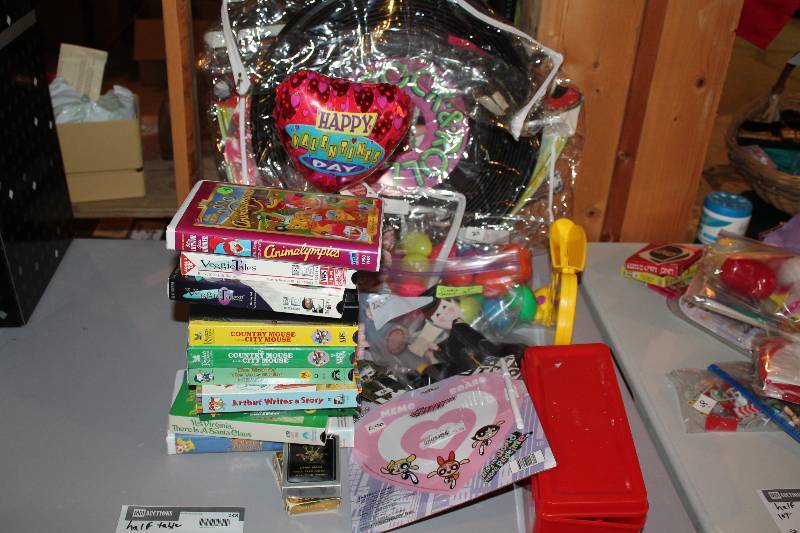 lot 148 image: Half Table Lot Including Childrens Movies Birthday Decorations And More.