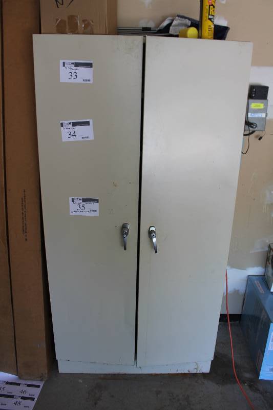lot 35 image: Metal Cabinet wDouble Doors & Handles 6 Shelves Contents Not Included 19 x 36 x 72.