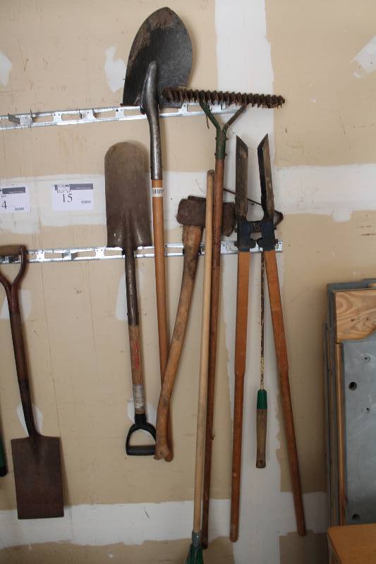 lot 15 image: Wall Lot Including Metal Shovels (2) Rake Metal Rake Post Digger And More.