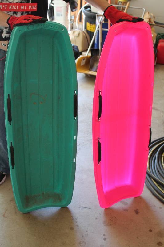 lot 25 image: Lot of (2) Plastic Snow Sleds Pink & Green.