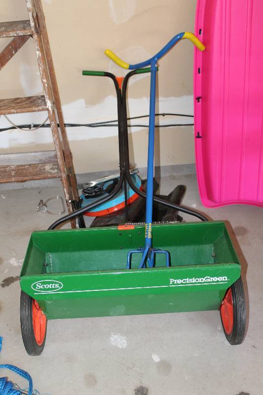 lot 26 image: Lot of (2) Including Scotts Seeder wWheels & Push Handle Garden Claw Weed Puller.
